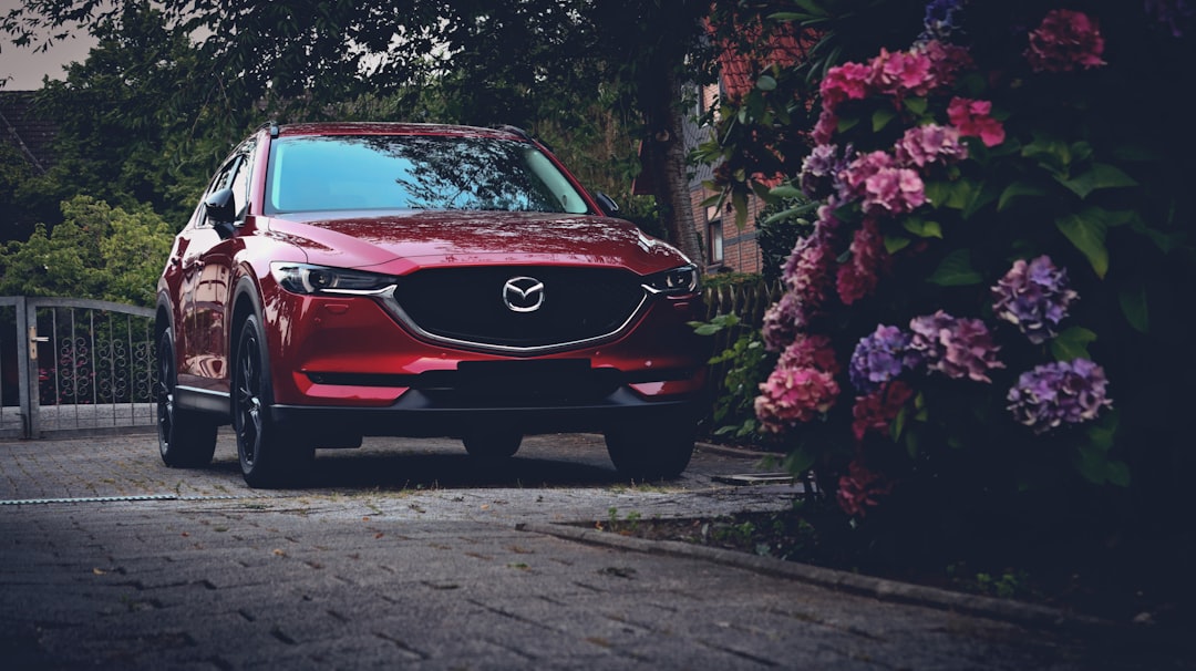 red Mazda SUV car